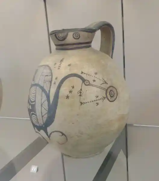 Solar disc and a bird design on a jug